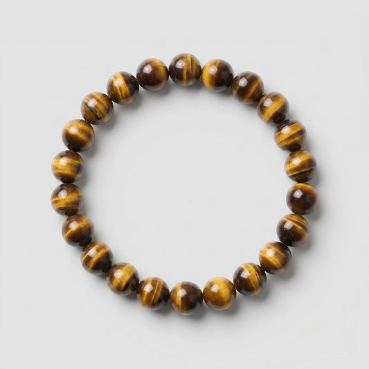 Beaded bracelet with tiger eye pattern on a light gray background